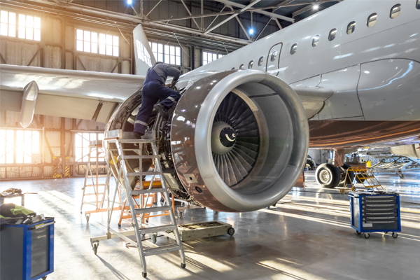 Aircraft in hangar being worked on