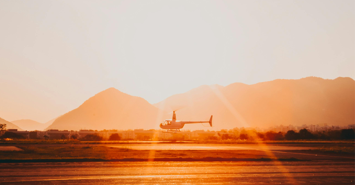 helicopter on sunset background